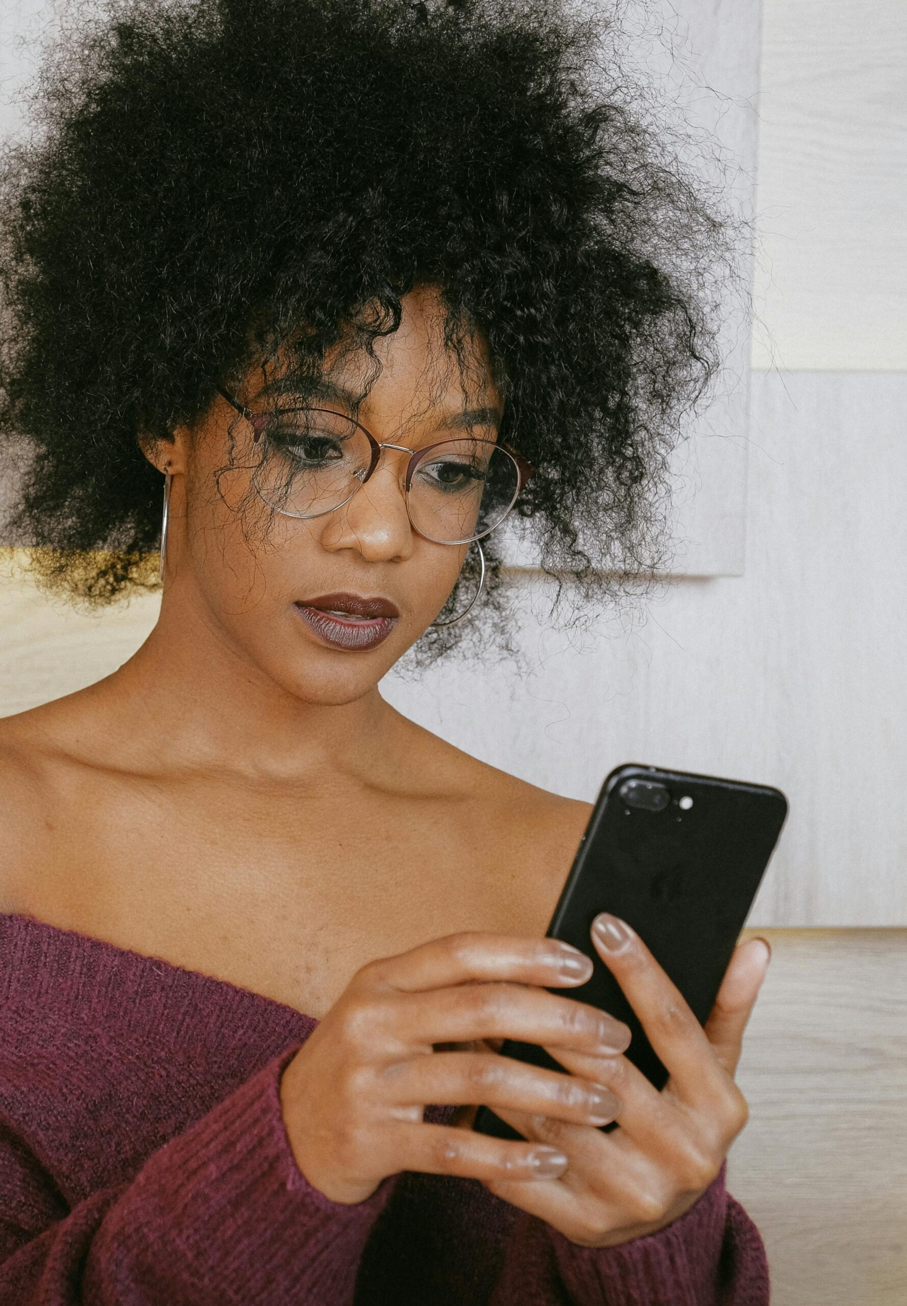 Person holding phone, ready to make a call or send a message.