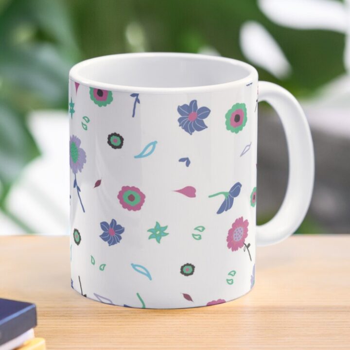 Ceramic flower mug featuring a wraparound white and pink floral pattern design. Designed by Zuzanii Designs.