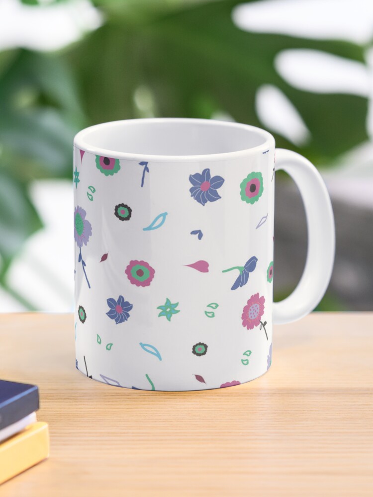 Ceramic flower mug featuring a wraparound white and pink floral pattern design. Designed by Zuzanii Designs.