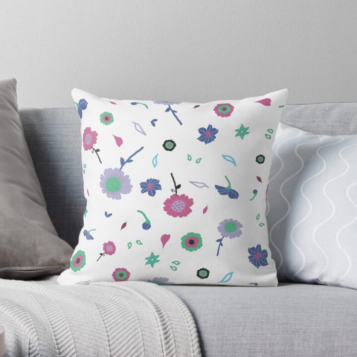 A throw pillow featuring an original white and pink floral pattern, made with a 100% spun polyester cover. One of many floral pillowcases designed by independent artist Zuzanii Designs.