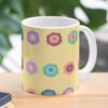 Ceramic flower mug featuring a wraparound bright summer yellow floral pattern design. Designed by Zuzanii Designs.