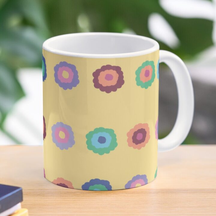 Ceramic flower mug featuring a wraparound bright summer yellow floral pattern design. Designed by Zuzanii Designs.