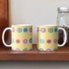 Two ceramic flower mugs featuring a wraparound bright summer yellow floral pattern design. Designed by Zuzanii Designs.