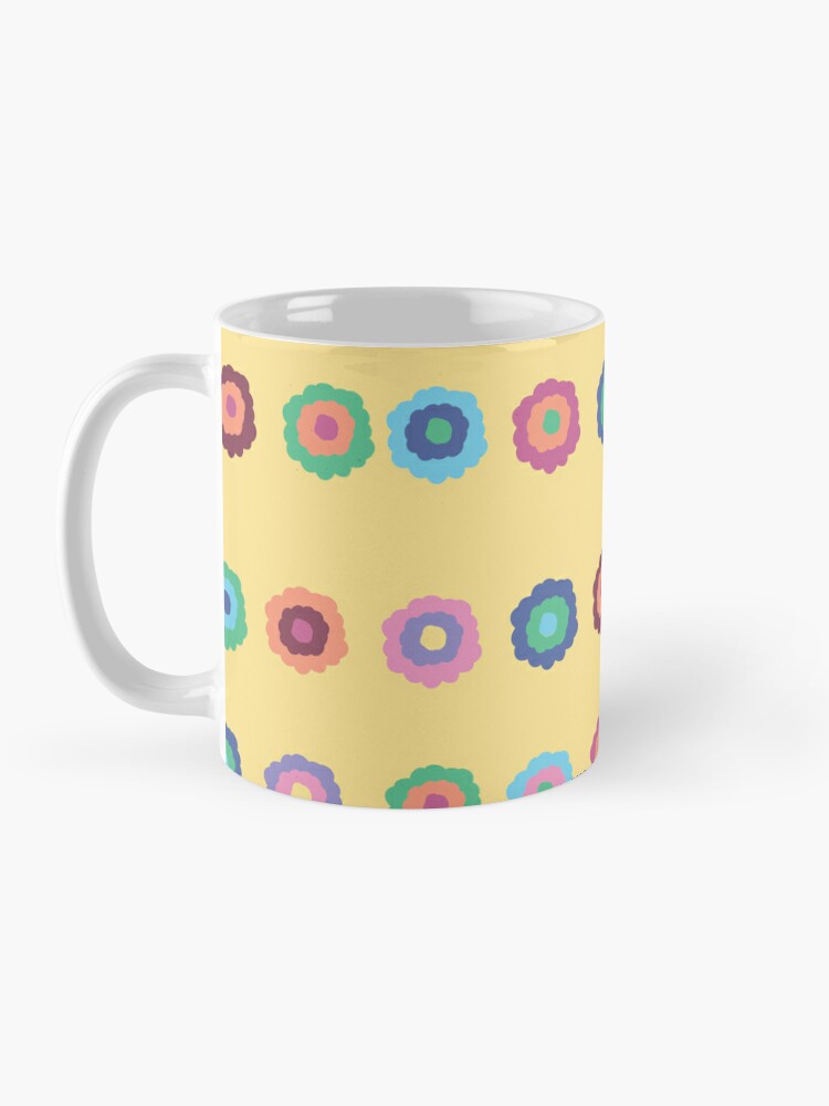 Ceramic flower mug featuring a wraparound bright summer yellow floral pattern design. Designed by Zuzanii Designs.