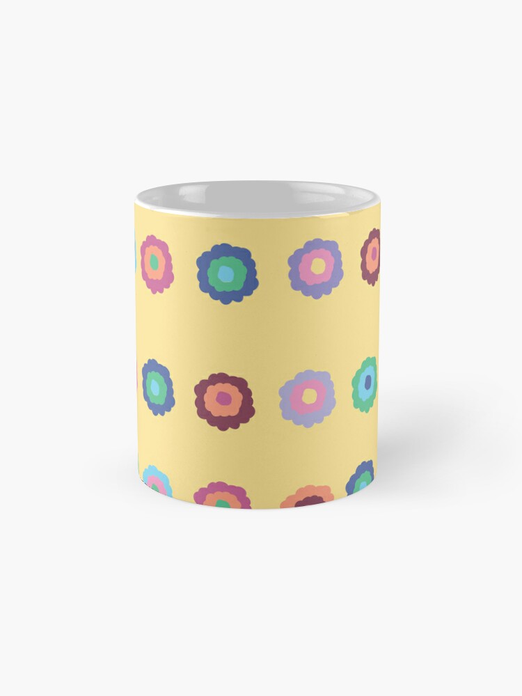 Ceramic flower mug featuring a wraparound bright summer yellow floral pattern design. Designed by Zuzanii Designs.