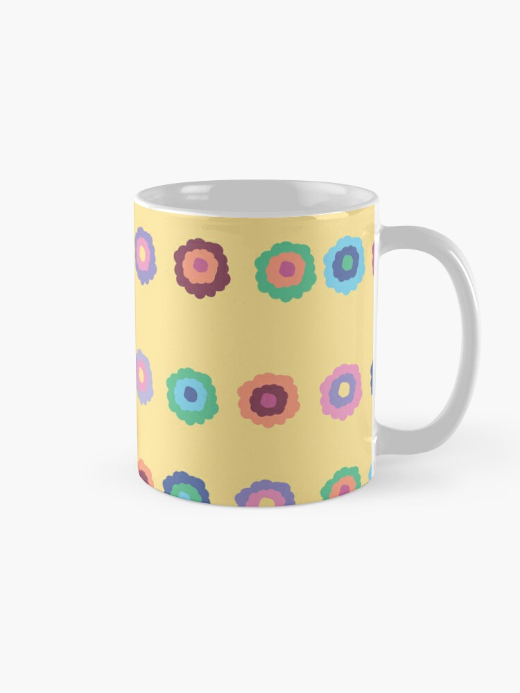 Ceramic flower mug featuring a wraparound bright summer yellow floral pattern design. Designed by Zuzanii Designs.