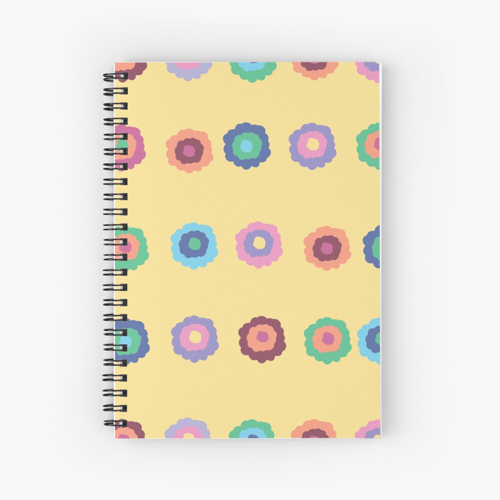 A spiral A5 notebook featuring a bright summer yellow floral front cover print by independent designer Zuzanii Designs.