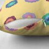 Close-up of concealed zip opening on throw pillow featuring an original bright summer yellow floral pattern, made with a 100% spun polyester cover. One of many floral pillowcases designed by independent artist Zuzanii Designs.
