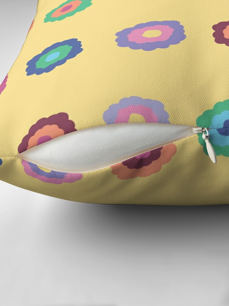 Close-up of concealed zip opening on throw pillow featuring an original bright summer yellow floral pattern, made with a 100% spun polyester cover. One of many floral pillowcases designed by independent artist Zuzanii Designs.