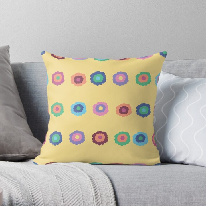 A throw pillow featuring an original bright summer yellow floral pattern, made with a 100% spun polyester cover. One of many floral pillowcases designed by independent artist Zuzanii Designs.