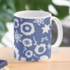 Ceramic flower mug featuring a wraparound blue and white floral pattern design. Designed by Zuzanii Designs.