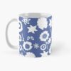Ceramic flower mug featuring a wraparound blue and white floral pattern design. Designed by Zuzanii Designs.