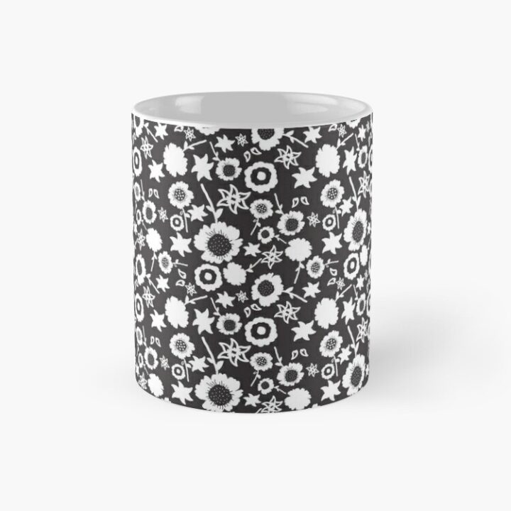 Ceramic flower mug featuring a wraparound black and white floral pattern design. Designed by Zuzanii Designs.